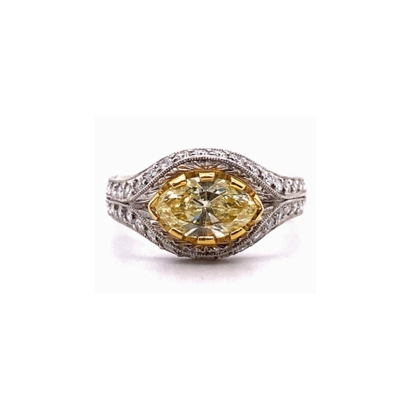 a fancy yellow diamond ring
