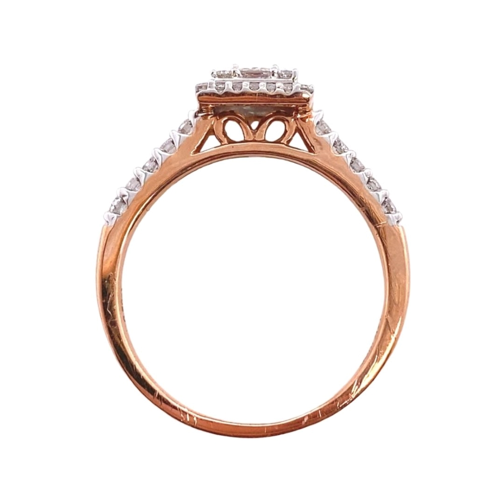 a rose gold ring with two diamonds on top