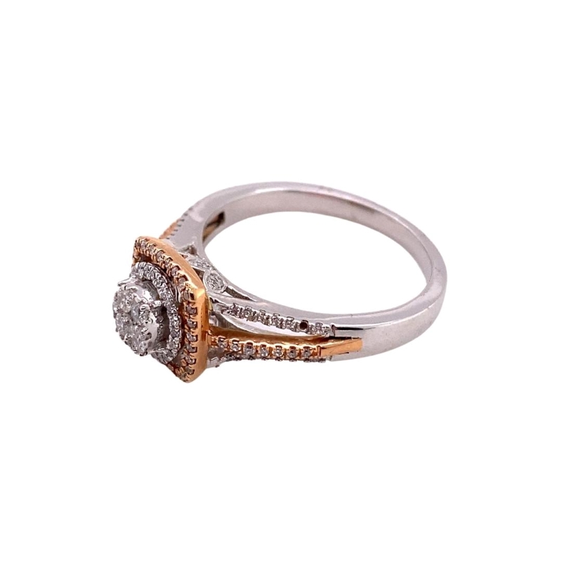 a diamond ring with two tone gold and white diamonds
