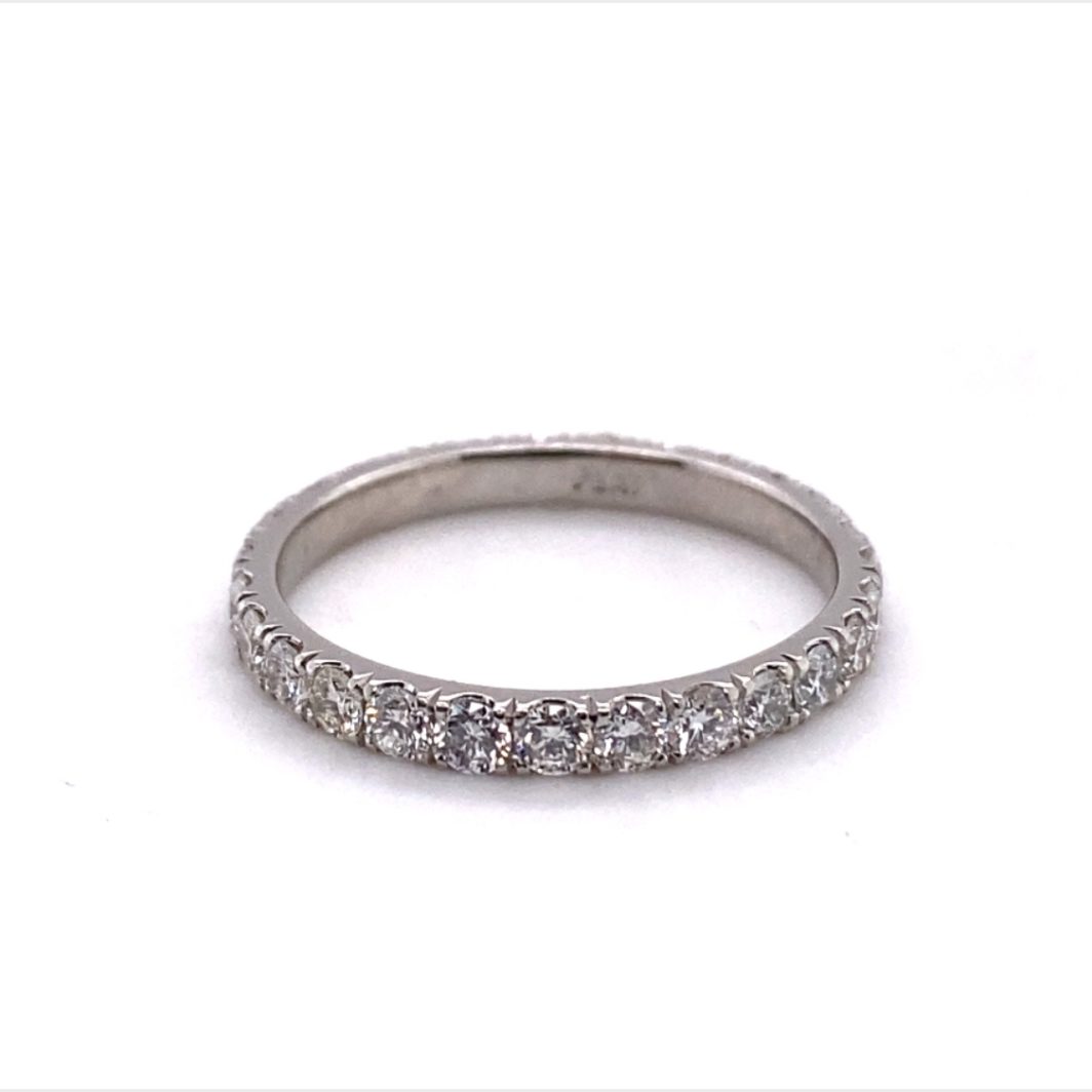 a wedding band with five diamonds on it