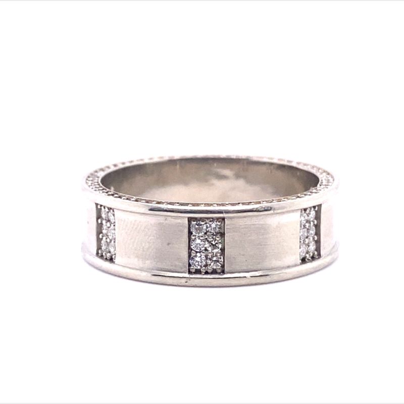 a white gold ring with diamonds on it