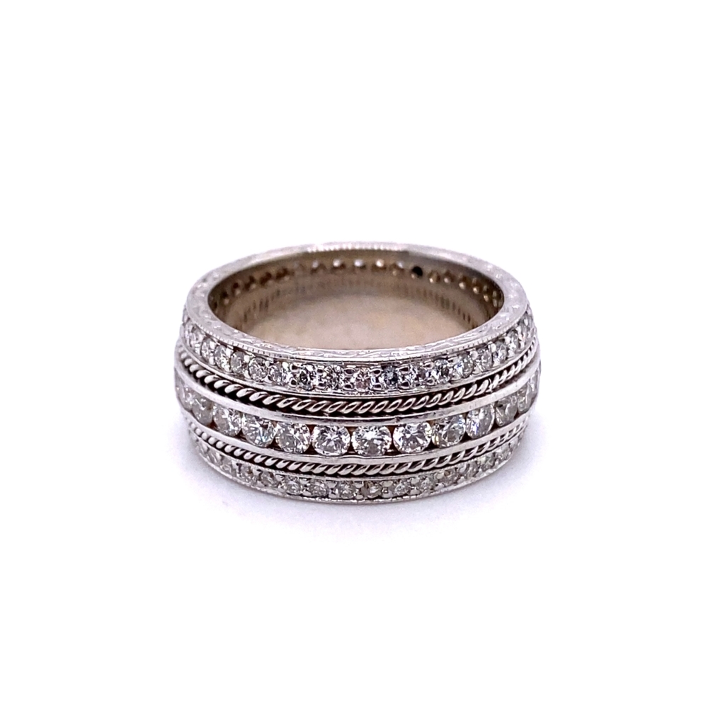 a stack of silver rings with diamonds on top