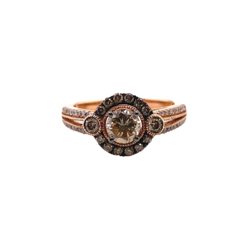 a ring with a brown diamond in it