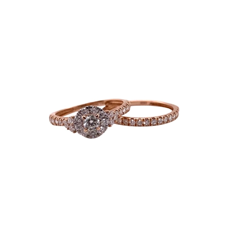 two diamond engagement rings on a white background