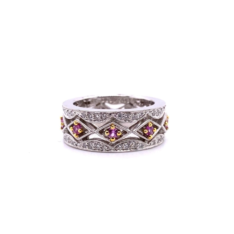 a white gold ring with pink and yellow diamonds