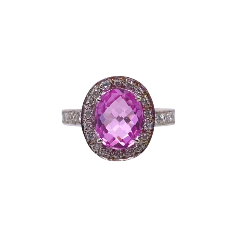 an oval shaped pink sapphire and diamond ring
