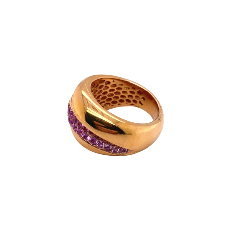 a gold ring with purple stones on it