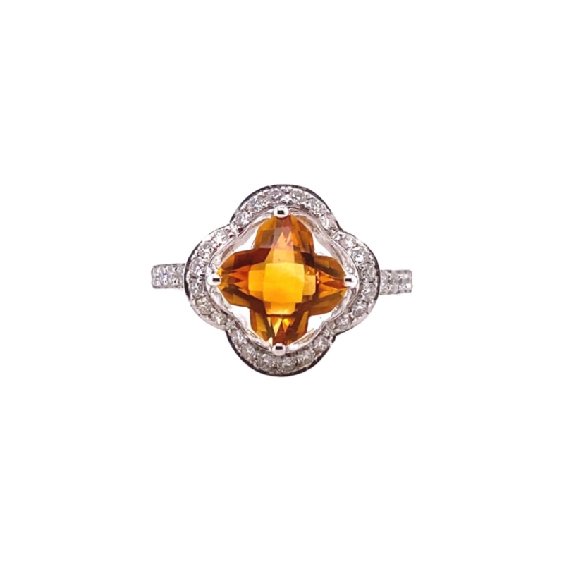 an orange sapphire and diamond ring