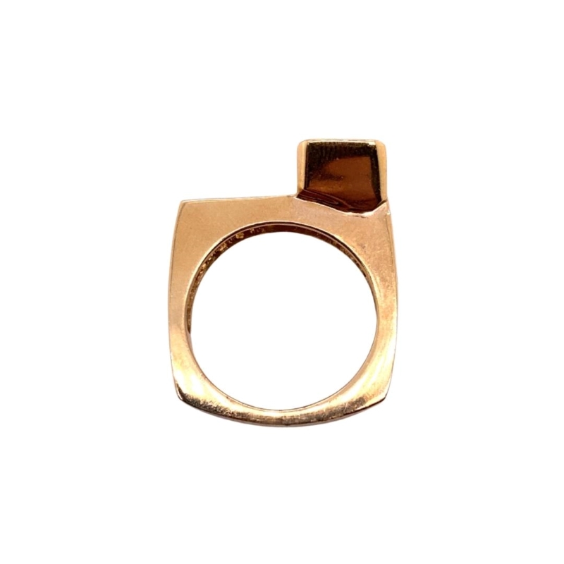 a gold ring with a brown stone in the middle