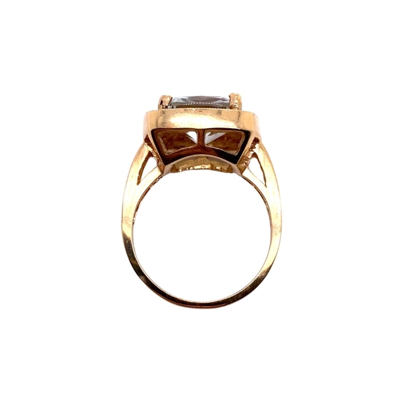 a gold ring with a brown stone in the center