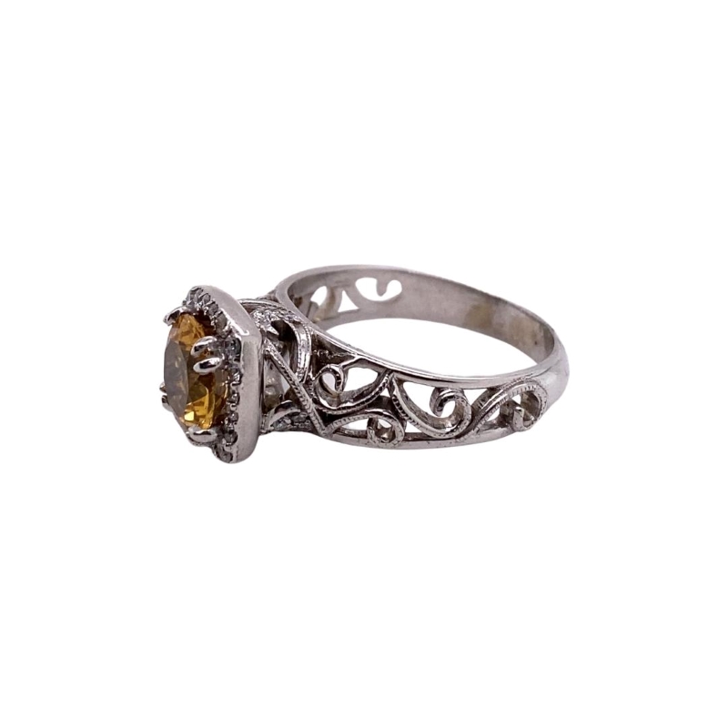 a ring with an orange stone in the center