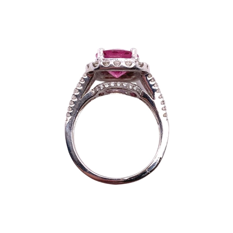 a ring with a pink stone in the center