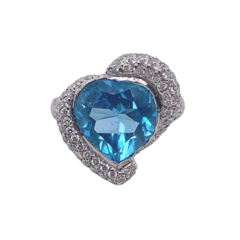 a blue heart shaped ring with diamonds around it