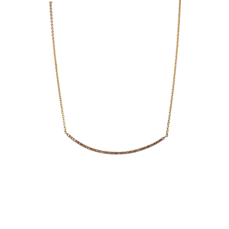 a gold necklace with three small diamonds on it