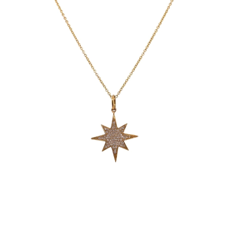 a gold necklace with a small star on it