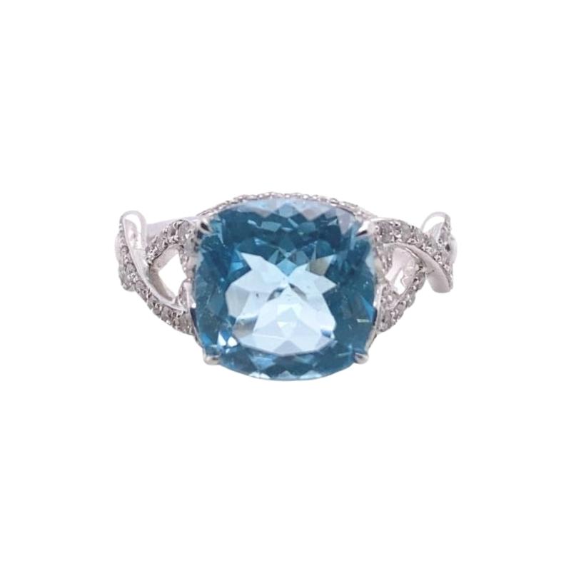 a ring with an aqua blue stone and diamonds