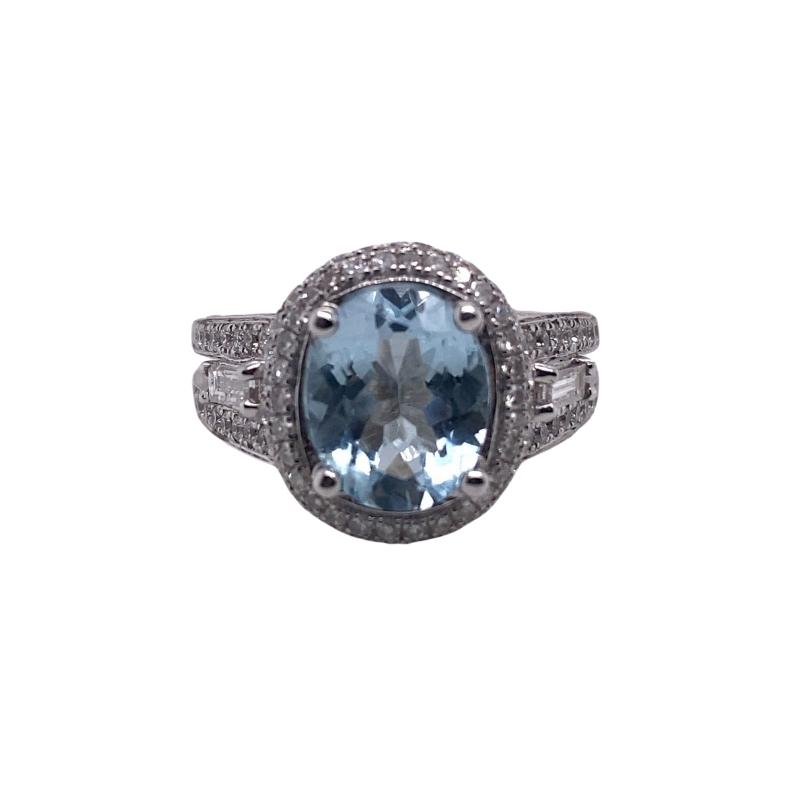 a ring with an oval blue stone surrounded by diamonds