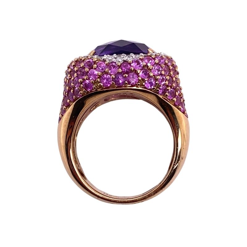 a ring with purple and white stones on it