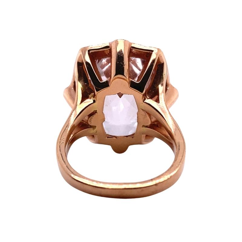 a ring with a white stone in the center