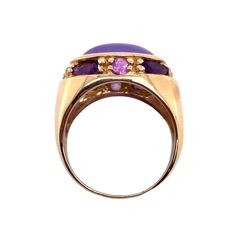 a gold ring with amethyst and purple stones