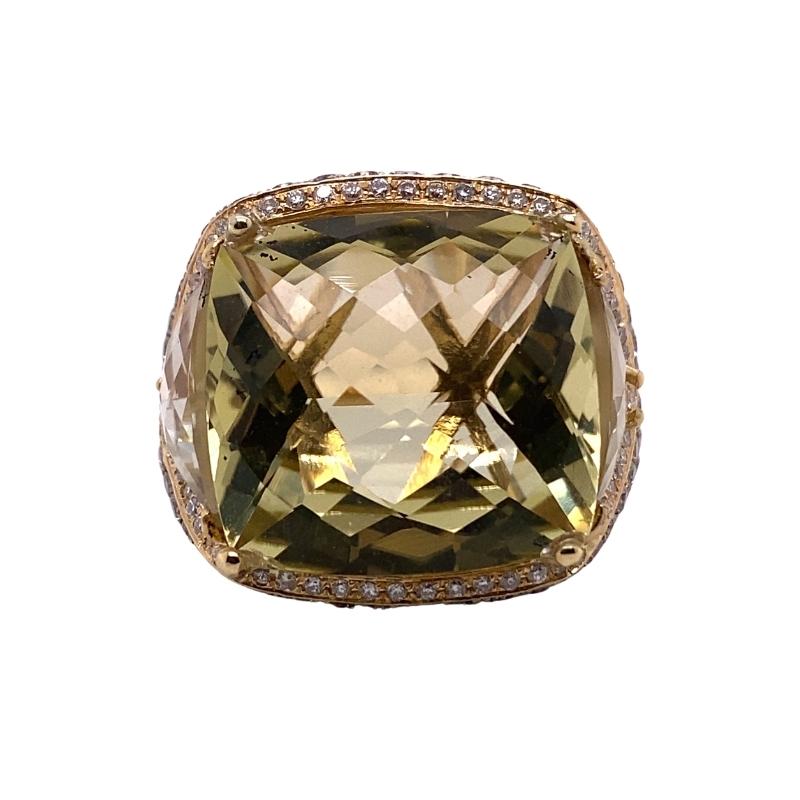 a ring with a large green stone surrounded by diamonds