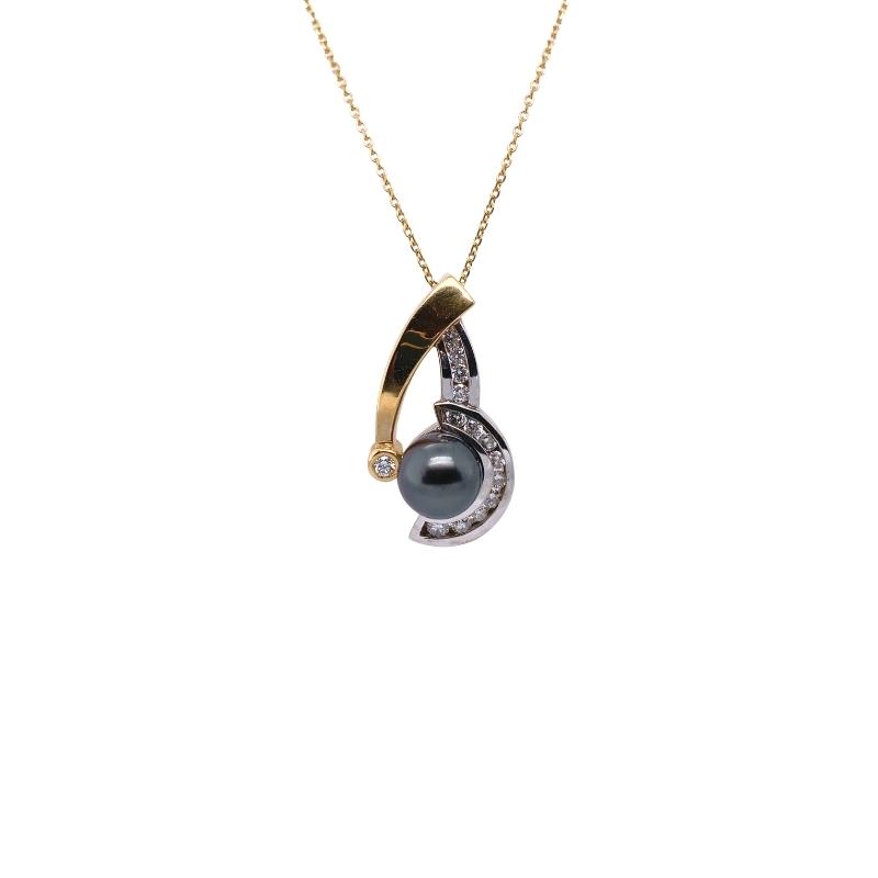 a black pearl and diamond pendant on a gold chain