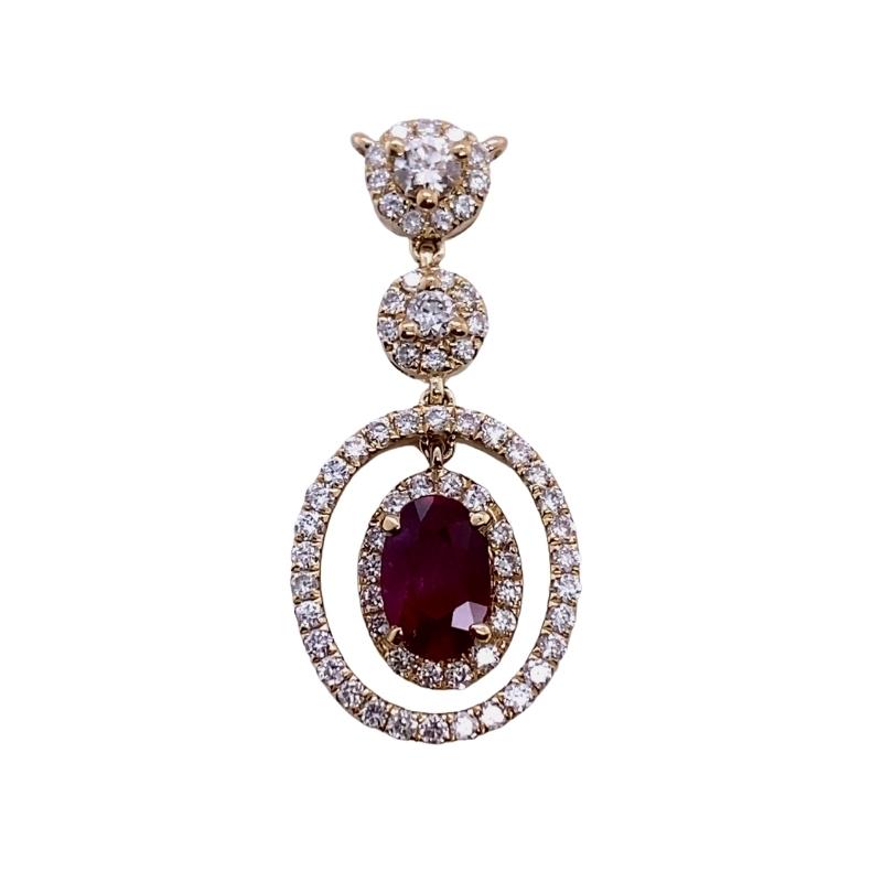 a necklace with a large oval shaped red stone surrounded by smaller round diamonds
