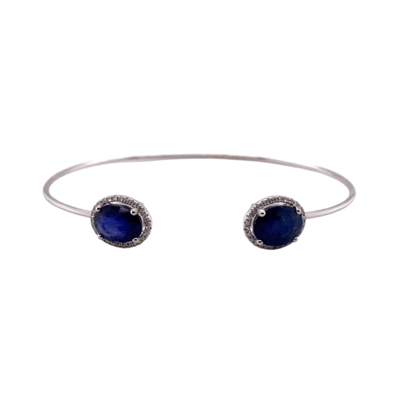 a silver bracelet with two blue stones on it