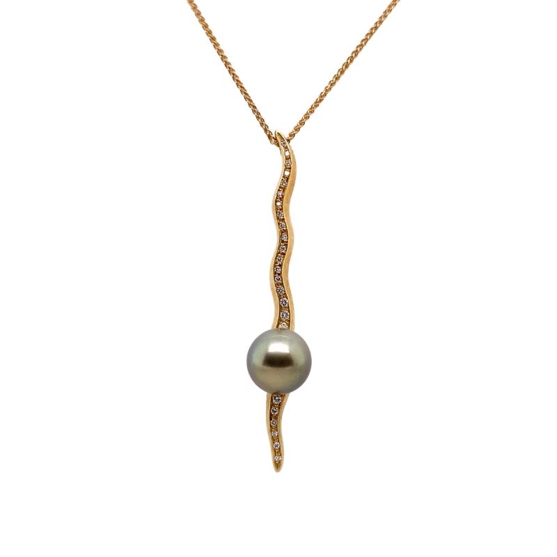 a pearl and diamond pendant on a gold chain