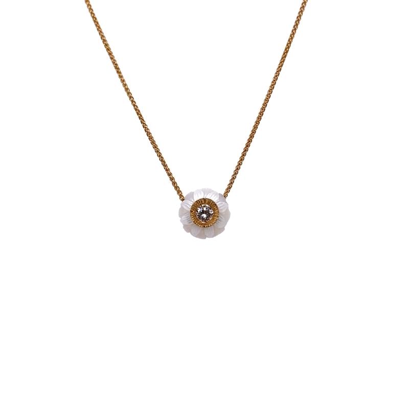 a gold necklace with an evil eye on it