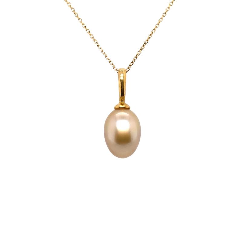 a pearl pendant on a gold chain