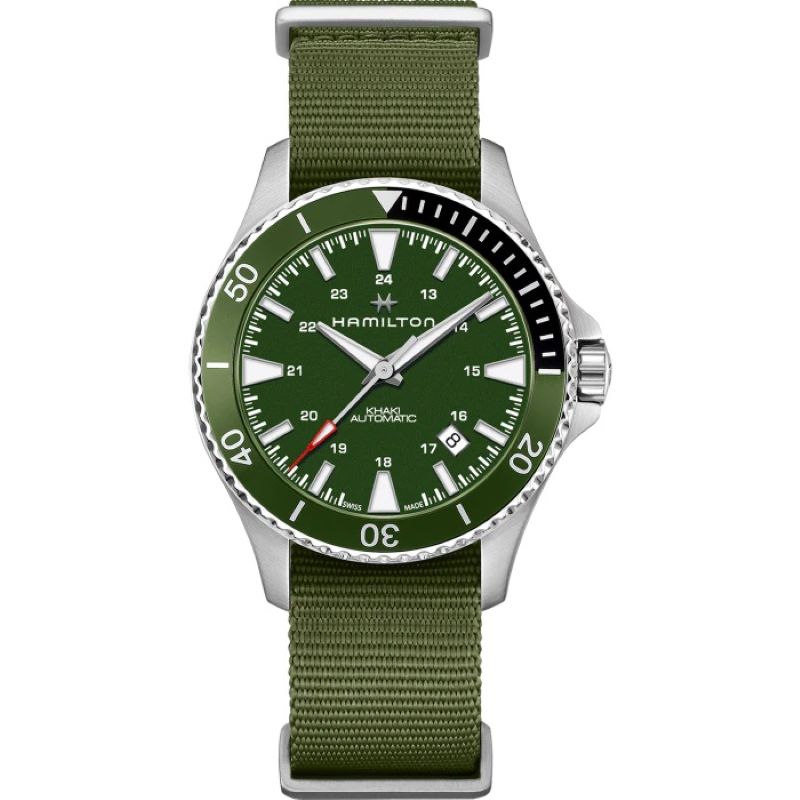 a green watch with white numbers on the face