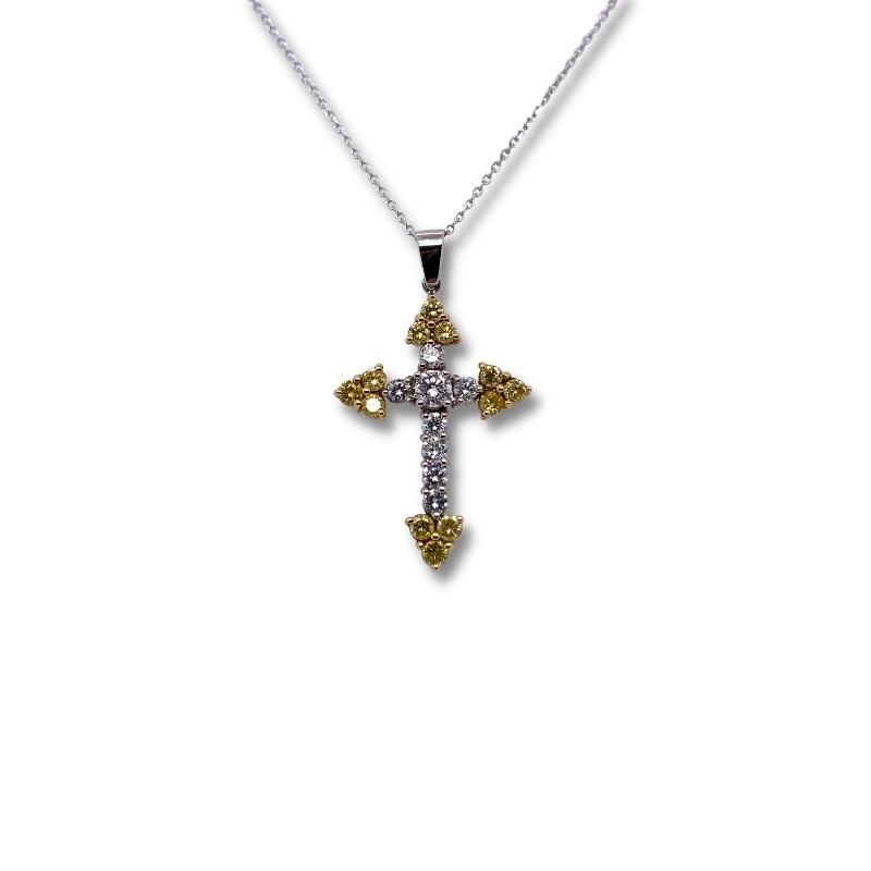 a cross pendant with two tone gold and white diamonds