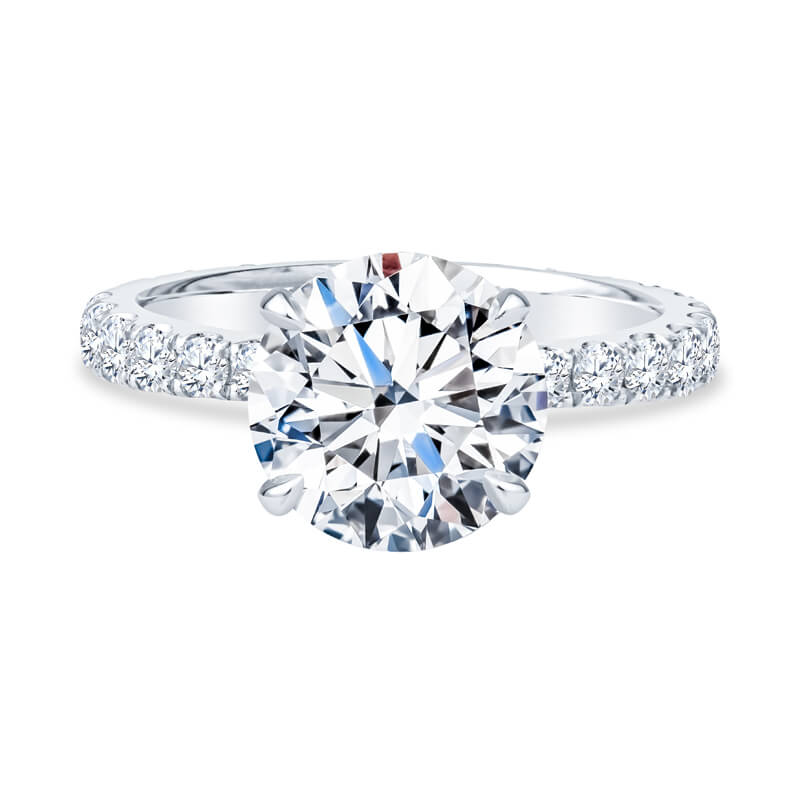 a round brilliant cut diamond ring with pave set shoulders