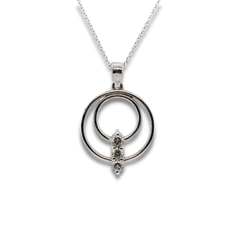 a silver pendant with two circles on it