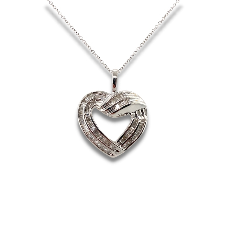 a heart shaped pendant with diamonds on a chain