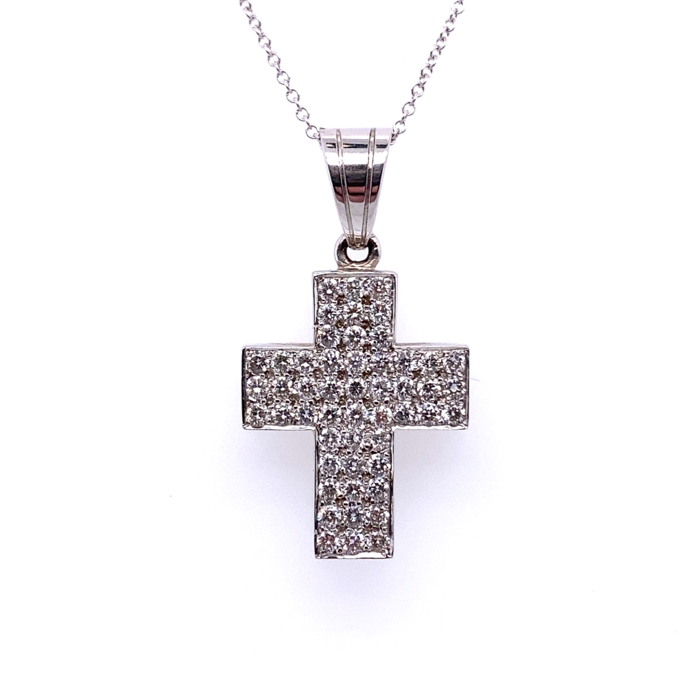 a cross pendant with white diamonds on a chain