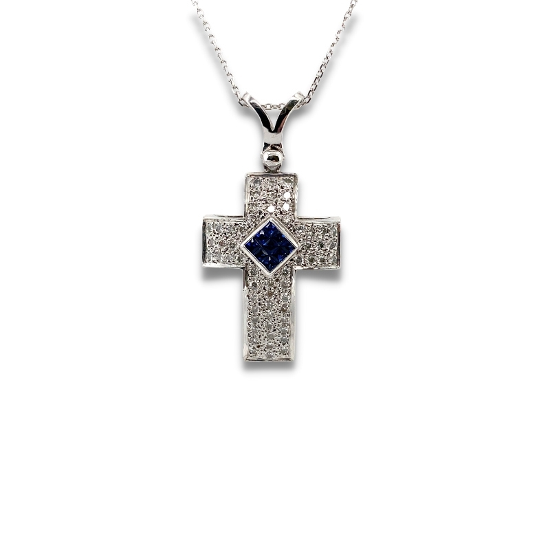 a cross pendant with blue and white diamonds