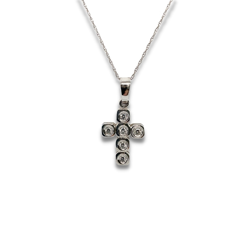 a silver cross necklace with three diamonds on it
