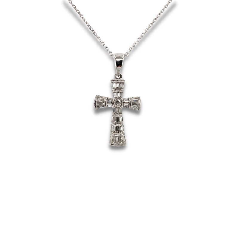 a silver cross necklace on a white background