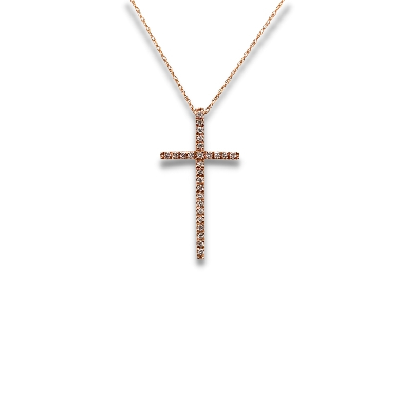 a diamond cross necklace on a white background