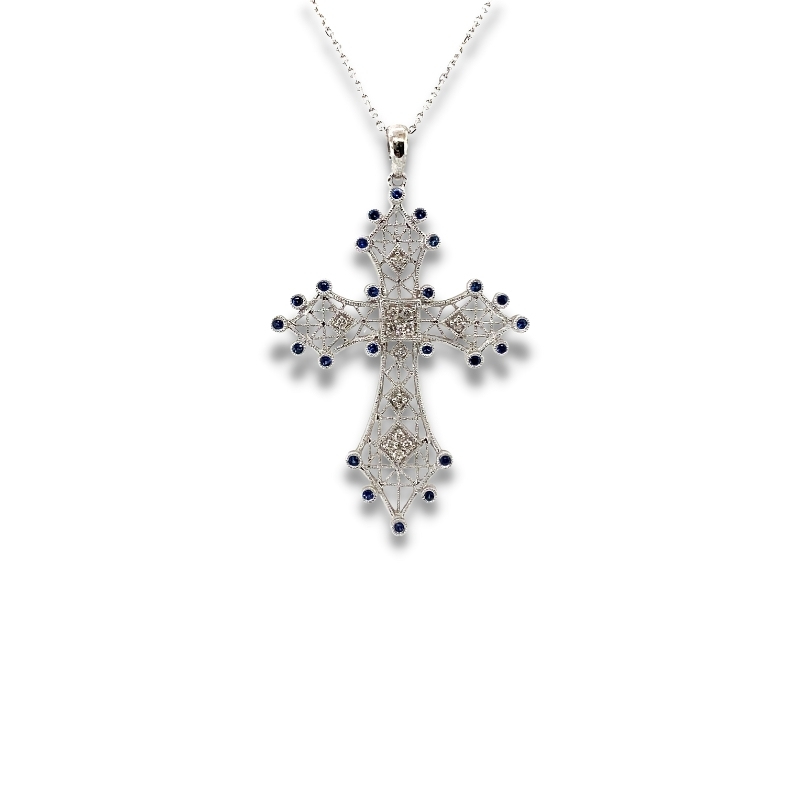a cross pendant with blue beads on a chain