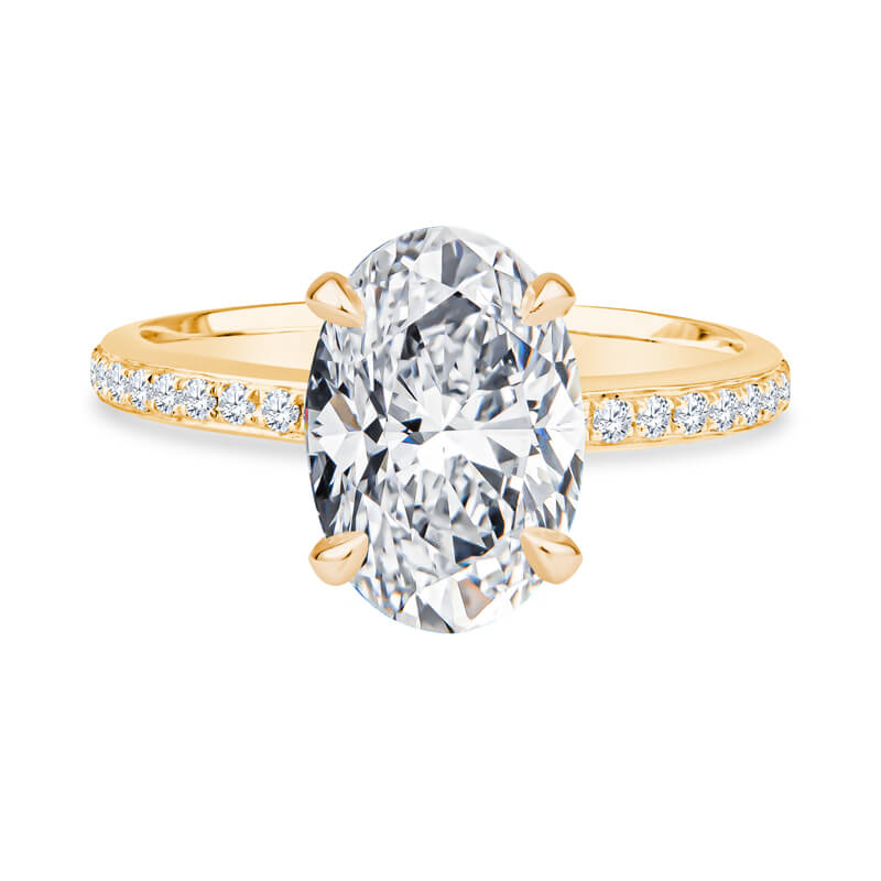 a yellow gold ring with a large oval cut diamond