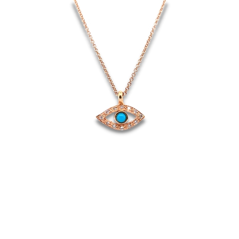 a gold necklace with an evil eye charm