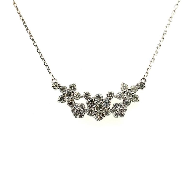 a silver necklace with flowers on it