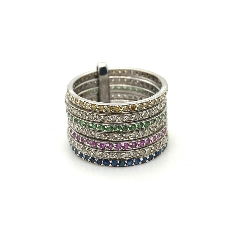 a stack of rings with different colored stones