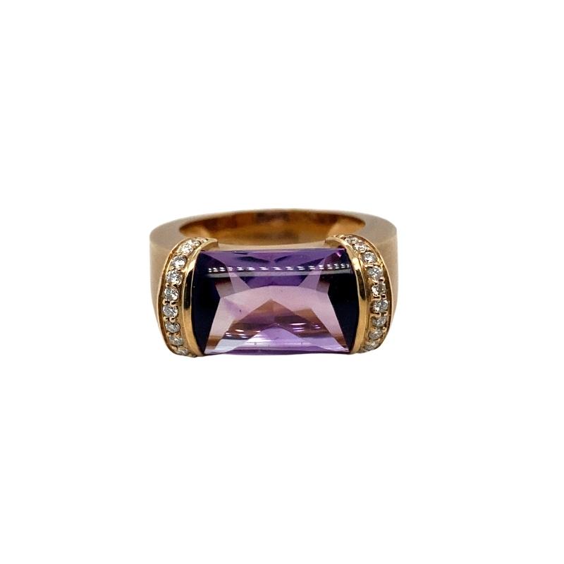 a gold ring with an amethorate and diamonds