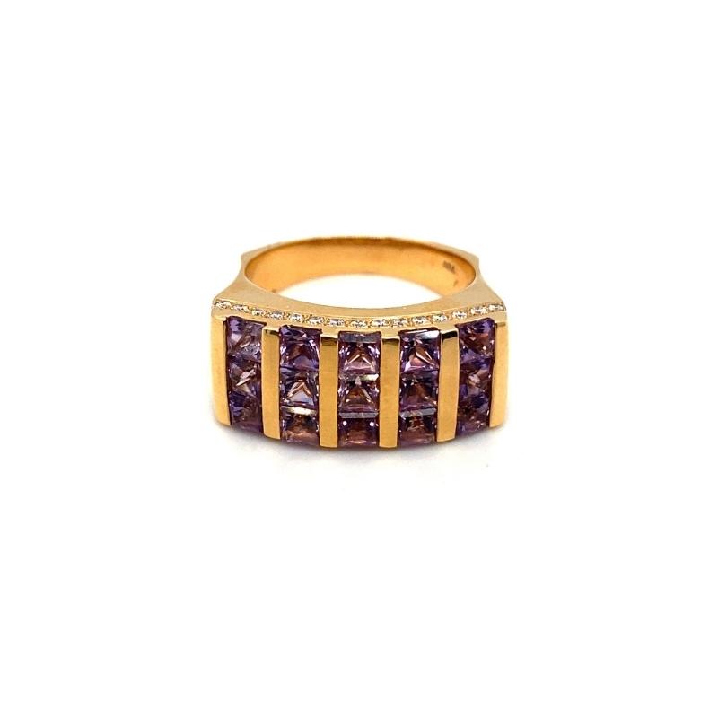 a gold ring with brown diamonds on it