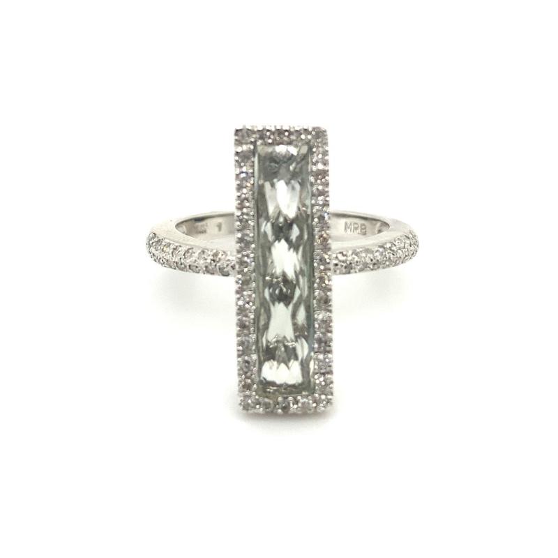 a white gold ring with an emerald and diamonds