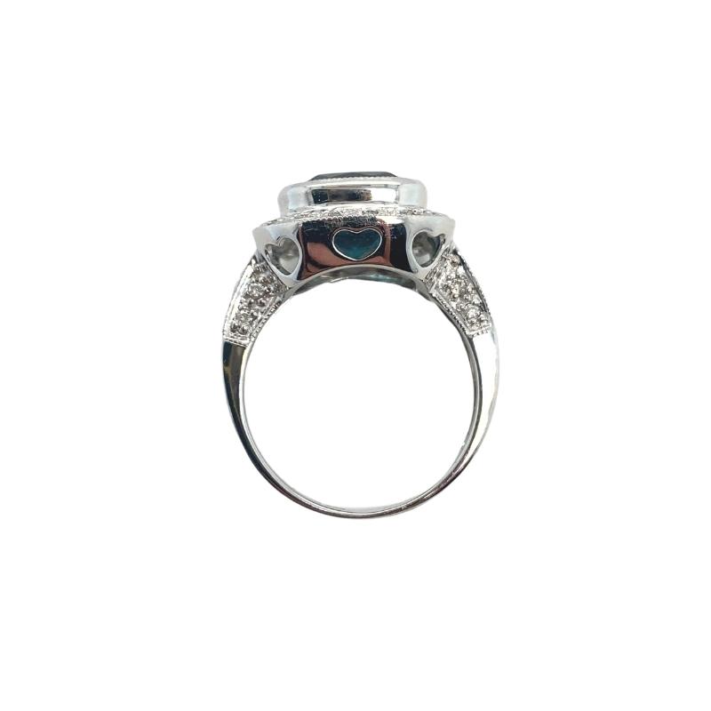 a white gold ring with a black and white diamond